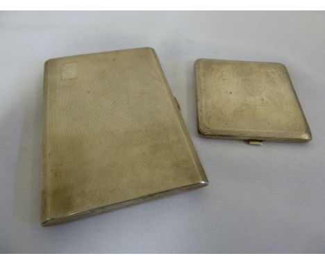 A silver engine turned cigarette case and a silver engine turned compact