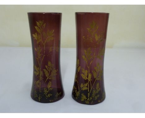 A pair of amethyst vases with gilded leaf decorations  A/F