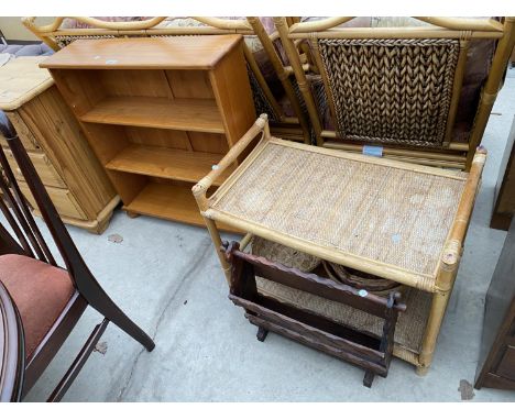 A PINE THREE TIER BOOKCASE, A PINE MAGAZINE RACK AND A BAMBOO TABLE WITH FOUR SMALL WICKER BASKETS 