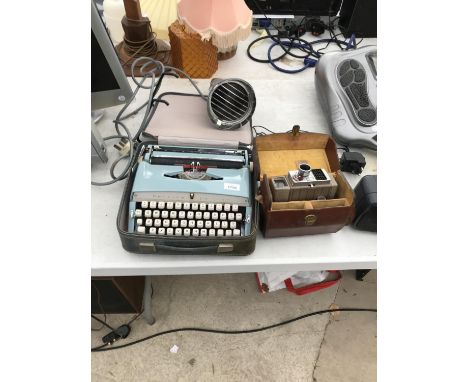 A BROTHER DELUXE TYPE WRITER, A PHILLIPS LIGHT AND A VINTAGE CAMERA 