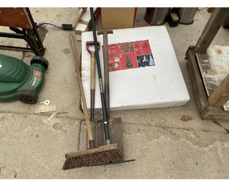 A CHRISTMAS TREE AND VARIOUS GARDEN TOOLS 