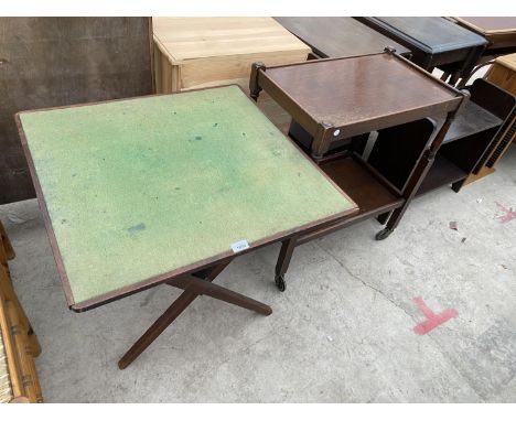 A FOLD-OVER CARD TABLE, A DINNER TROLLEY AND AN OPEN BOOKCASE 