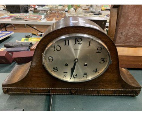A LARGE OAK NAPOLEON'S HAT CHIMING MANTEL CLOCK 
