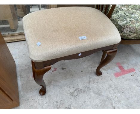 A MDOERN UNIVERSAL UPHOLSTERED STOOL ON CABRIOLE LEGS 