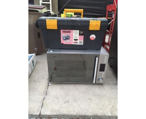 A STAINLESS STEEL MICROWAVE AND A TOOLBOX CONTAINING TOOLS 