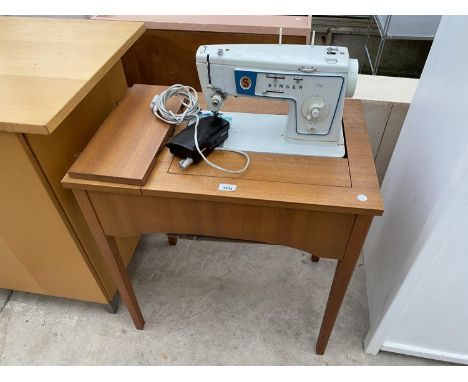 A SINGER 416 ELECTRIC SEWING MACHINE ON FREE STANDING TABLE 