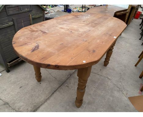 A PINE DINING TABLE 