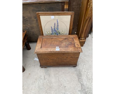 A SMALL OAK CHEST WITH HINGED TOP AND A TAPESTRY FIRESCREEN 