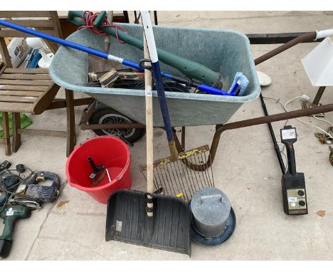 A WHEELBARROW AND VARIOUS GARDEN TOOLS 