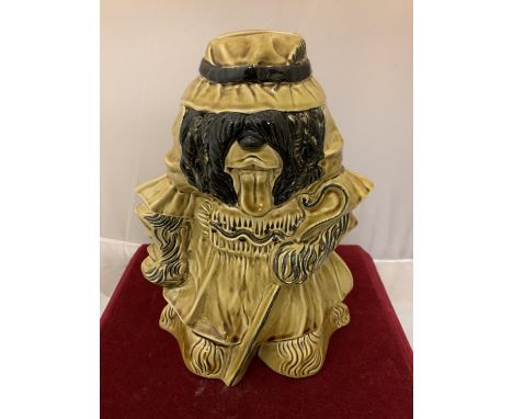A PILKINGTONS LANCASTRIAN POTTERY MONEYBOX IN THE FORM OF AN OLD ENGLISH SHEEP DOG IN LIGHT BROWN GLAZE 
