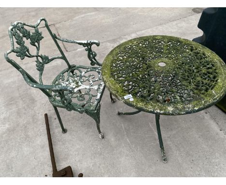 A METAL GARDEN TABLE AND CHAIR 