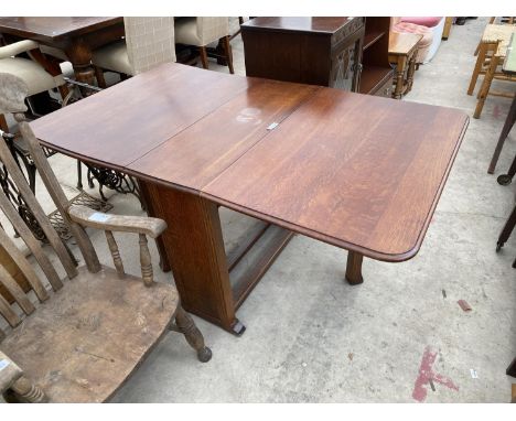 AN OAK DROP LEAF DINING TABLE 