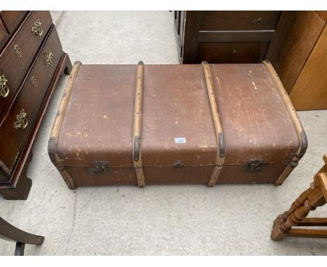 A VINTAGE WOOD BOUND TRAVEL TRUNK 