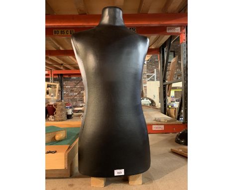 A MALE TORSO MANNEQUIN 
