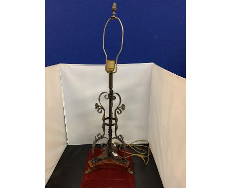 A VINTAGE METAL WESCAL LIGHT ON A WOODEN PLINTH 