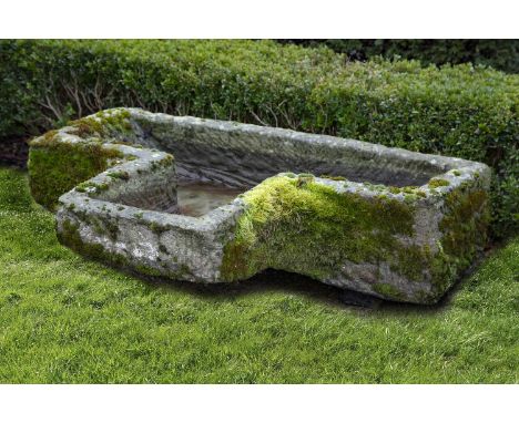A carved limestone trough, 19th century, of projecting rectangular form, 25cm high, 108cm long, 78cm wideBidders from the UK 