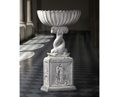 A Continental sculpted white marble basin on plinth, 19th century, the oval section basin with scalloped sides supported on t