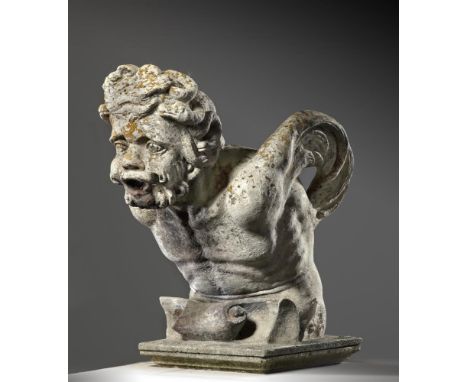 A Continental sculpted limestone fountainhead carved as the stylised head of a bearded man, 19th century, with wings protrudi