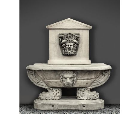 A sculpted white marble wall fountain and basin in the Renaissance style, 20th century, with pedimented wall mount centred by