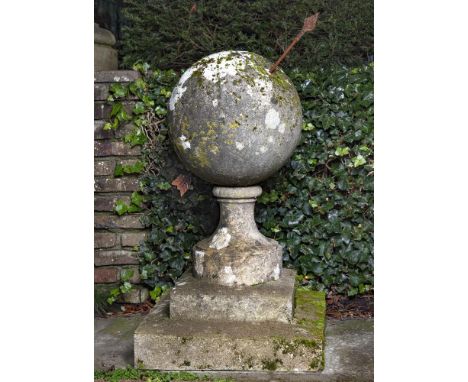 A rare and unusual French limestone sundial, 19th century, the limestone sphere pierced by a wrought iron gnomon, modelled as