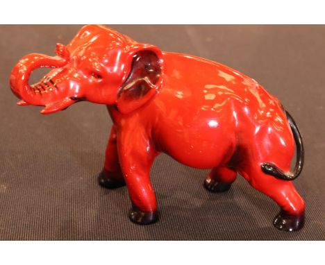 Royal Doulton Flambe elephant, H: 13.5 cm. P&P Group 1 (£14+VAT for the first lot and £1+VAT for subsequent lots)Condition Re