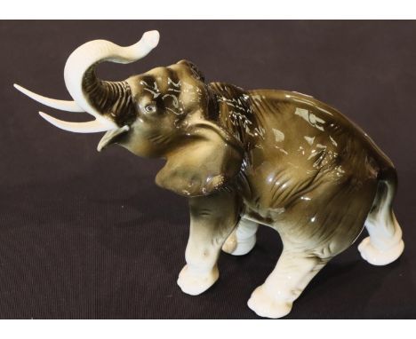 Royal Dux African elephant, H: 25 cm. P&P Group 3 (£25+VAT for the first lot and £5+VAT for subsequent lots)Condition Report: