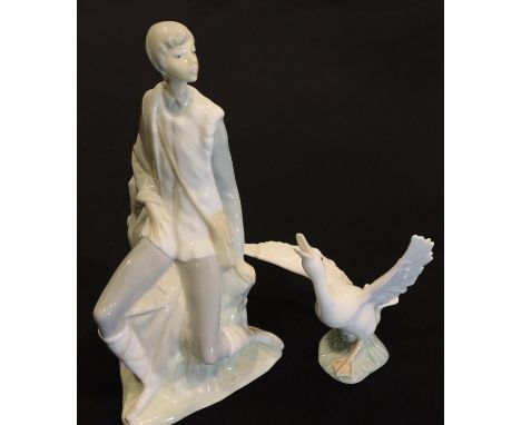 Nao large seated boy, H: 26 cm and a Lladro Goose. P&amp;P Group 3 (£25+VAT for the first lot and £5+VAT for subsequent lots)