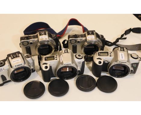 Five Canon film camera bodies, EOS 300, EOS 500, TWO EOS IX, and EOS IX7.  All working at time of lotting.  P&amp;P Group 2 (