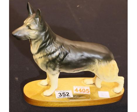 Royal Doulton Alsatian on a ceramic base. H: 22cm. P&amp;P Group 2 (£18+VAT for the first lot and £3+VAT for subsequent lots)