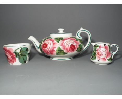 Wemyss Ware - A Wemyss teapot, sucrier and creamer, decorated in the Cabbage Rose pattern, impressed and signed 'Wemyss' to t