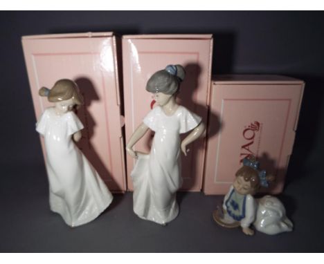 Nao - three Nao figurines to include #01110 Camison Con Vuelo, #01076 Nina A Gatas Con Papilla and #01109 Camison Ruborosa, a