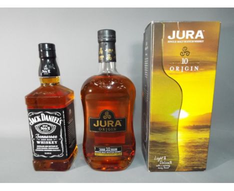 A 1 litre bottle of Jura Origin single malt Scotch whisky, 40 % ABV, contained in carton and a 70 cl bottle of Jack Daniel's 