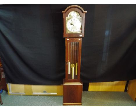 A Tempus Fugit grandmother clock with pendulum and three weights, with bevel edged glass fronted display, door marked verso w