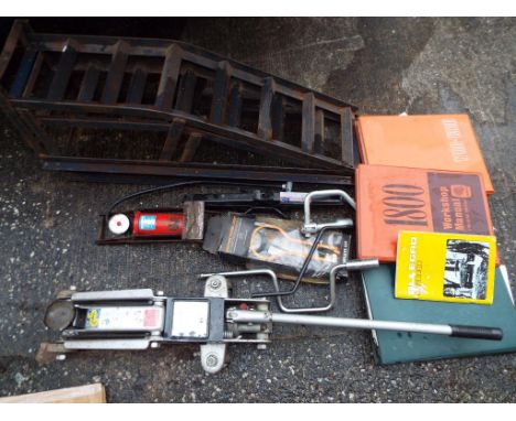 A quantity of various automobile tools, also included is a car jack. [3]