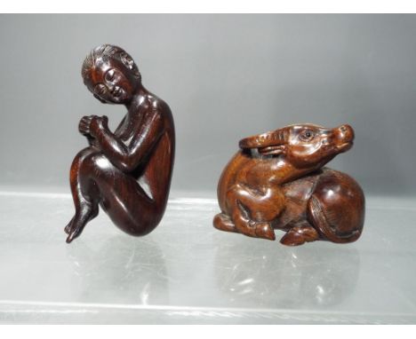 Netsuke - a lots comprising a vintage dark wood Japanese erotic Netsuke depicting a naked seated Oriental lady in excellent c