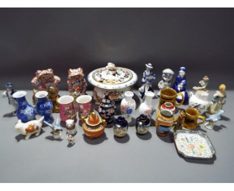 A mixed lot of ceramics to include Oriental vases, continental European figurines, crested ware and similar. Condition - Bird