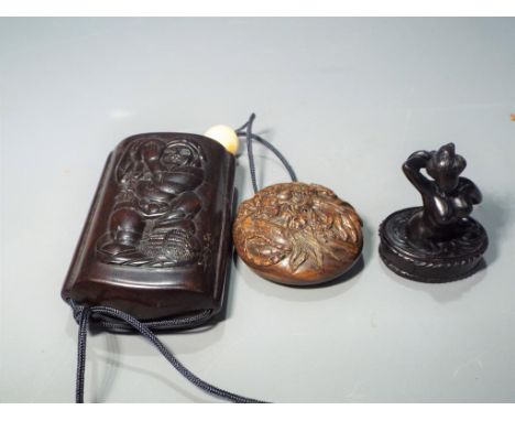 Netsuke - a vintage lacquered Japanese Inro and Netsuke, Inro is in excellent condition depicting an Oriental man carrying a 