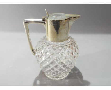 A hallmarked silver decanter.
