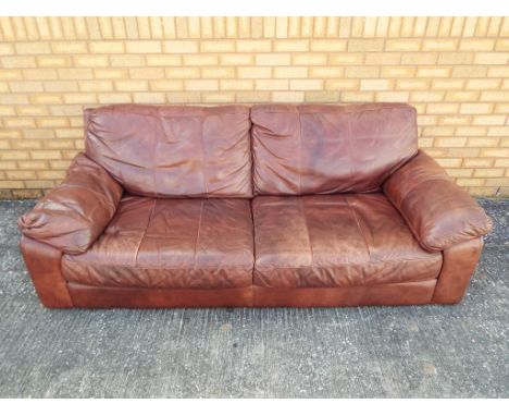 A three seater brown leather sofa, approximate height 78 cm x 200 cm x 102 cm This lot must be paid for and collected (or des