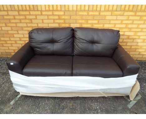 A good quality two seat sofa still in factory wrapping.
