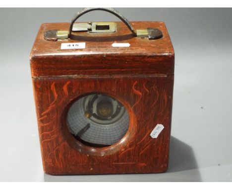 A pigeon clock in wooden case made by Boddy&amp;Ridewood. 