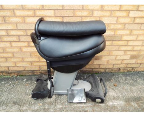 A Bodi-Tek Ride exercise machine with instruction manual.