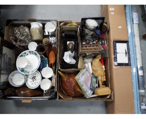 A mixed lot to include ceramics, glassware, carved wooden ornaments, pictures, wooden market parasol, contained in original b