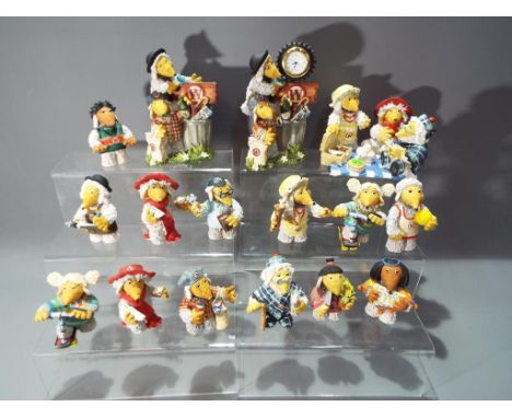 Wombles - a collection of sixteen ceramic figurines depicting various Wombles characters, varying in size from 8 cm to 13 cm 