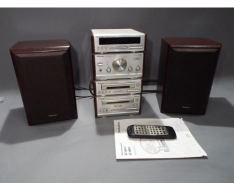 A vintage Technics SC-HD51 stereo system, comprising stereo tuner, CD and cassette players, amplifier, wood cased speakers, r
