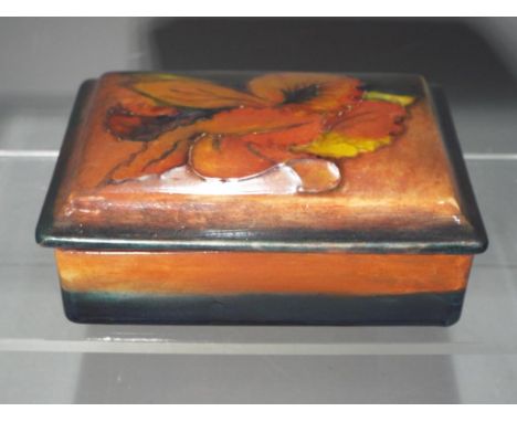 Moorcroft - A Moorcroft Pottery flambe trinket dish with cover, facsimile impressed signature to cover and Royal Warrant pape