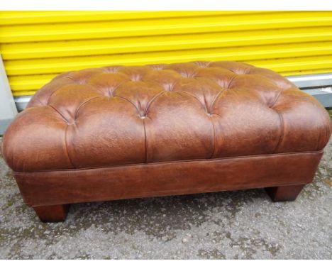 A John Lewis leather pouffe
