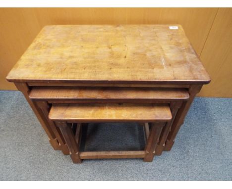 Robert Thompson (Mouseman) - a nest of three oak tables, each of which with feature carved mouse, 47 cm x 61 cm x 37 cm. Cond