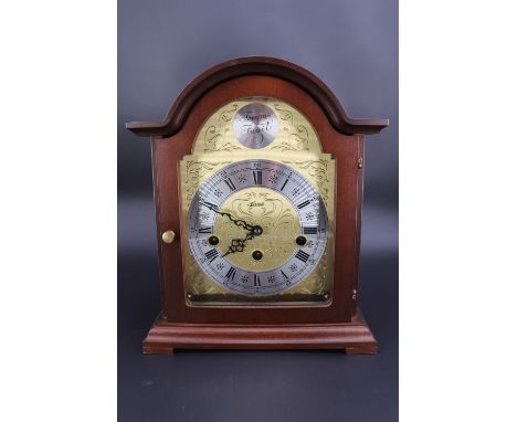 An Hermle mahogany cased mantle clock, having a three-train movement, 26 cm