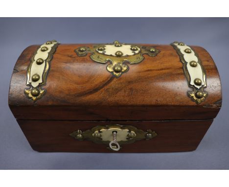 A Victorian walnut two compartment tea caddy decorated with gilt brass strapwork